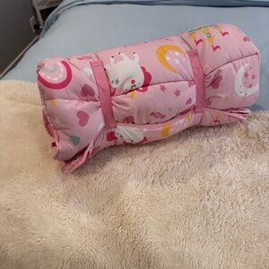 Kids roll in bed with pillow